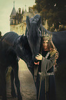 Friesian horses with child