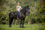 woman with Friesian Horse