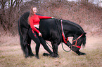 woman with Friesian Horse