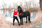 woman with Friesian Horse