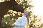 woman and Frisian horse