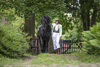 woman and Frisian horse