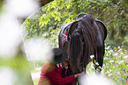 woman with Friesian horse