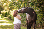 woman and German Riding Horse
