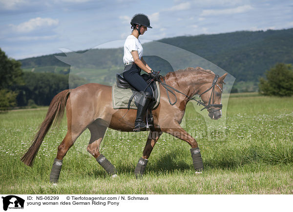 young woman rides German Riding Pony / NS-06299