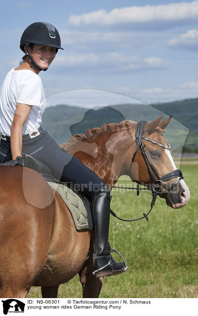 young woman rides German Riding Pony / NS-06301