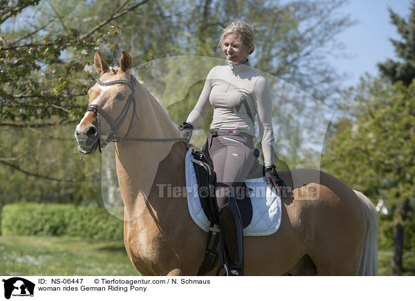 woman rides German Riding Pony / NS-06447