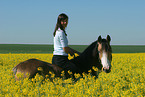 woman rides German Riding Pony