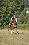 woman rides pony