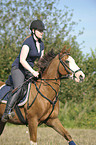 woman rides pony