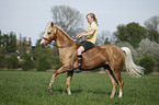 girl rides pony
