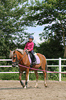 girl rides German Riding Pony