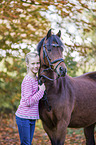 German Riding Pony with a child