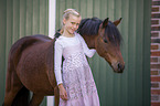 German Riding Pony with a child