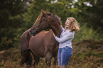 German Riding Pony with a woman