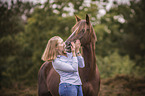 German Riding Pony with a woman