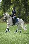 girl rides German Riding Pony