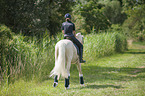 girl rides German Riding Pony