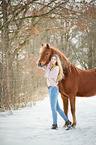 young woman with german riding pony