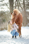 young woman with german riding pony