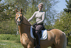 woman rides German Riding Pony