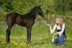 young woman with foal