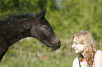 young woman with foal