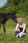 young woman with foal