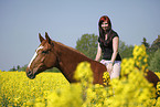 woman rides warmblood