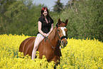 woman rides warmblood