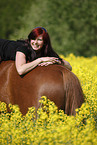 woman rides warmblood