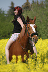 woman rides warmblood