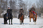 riders with horses