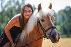 woman rides Haflinger