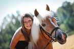 woman rides Haflinger