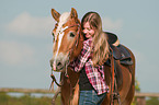 girl and Haflinger horse