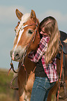 girl and Haflinger horse