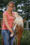 woman and Haflinger