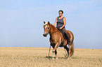 woman rides Haflinger Horse