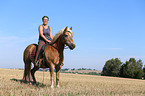 woman rides Haflinger Horse