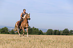 woman rides Haflinger Horse