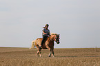 woman rides Haflinger Horse