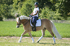 woman rides Haflinger