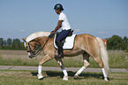 woman rides Haflinger