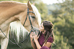 woman and Haflinger