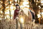 woman and Haflinger