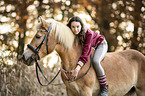 woman rides Haflinger