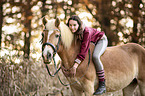 woman rides Haflinger