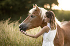 woman and Haflinger