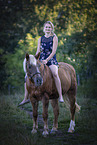 young woman with Haflinger